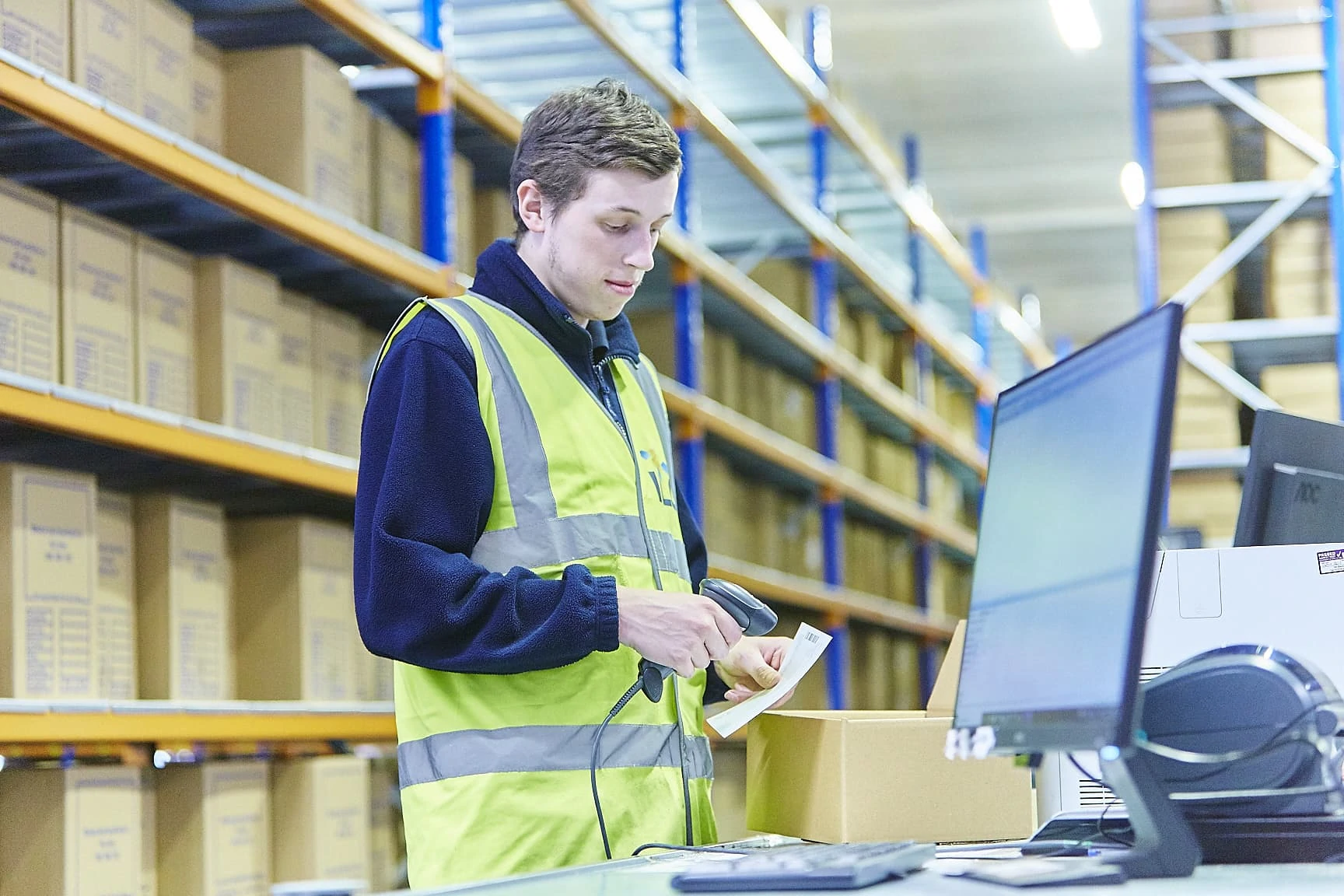 ILG warehouse employee scanning a receipt